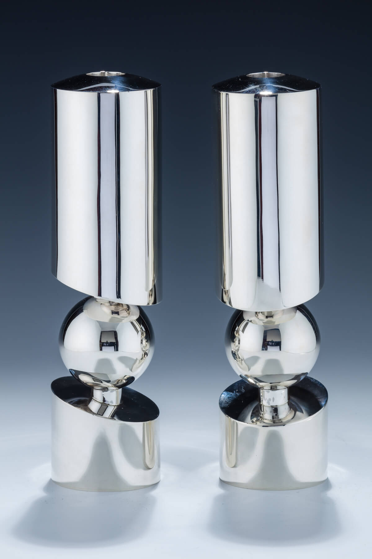 136. A Pair of Sterling Silver Candlesticks by Carmel Shabi