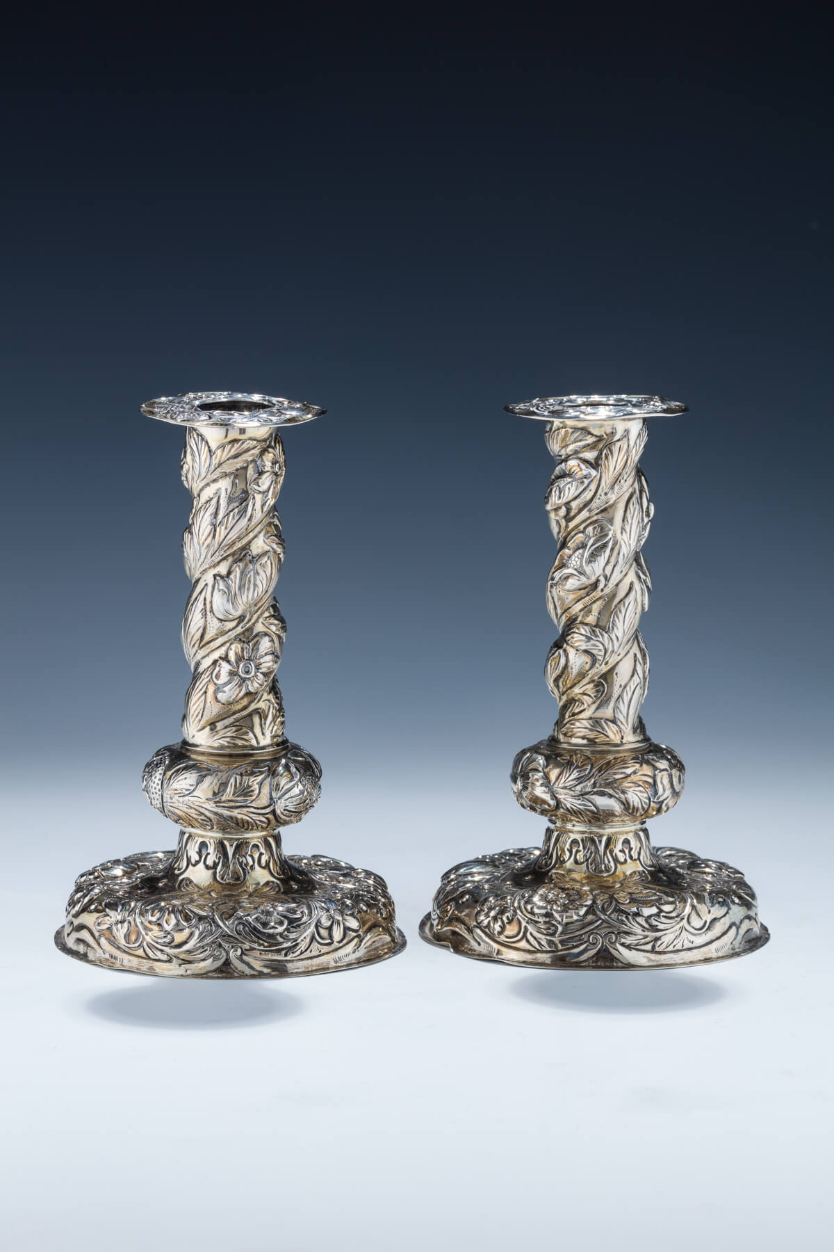 12. A Pair of Silver Candlesticks