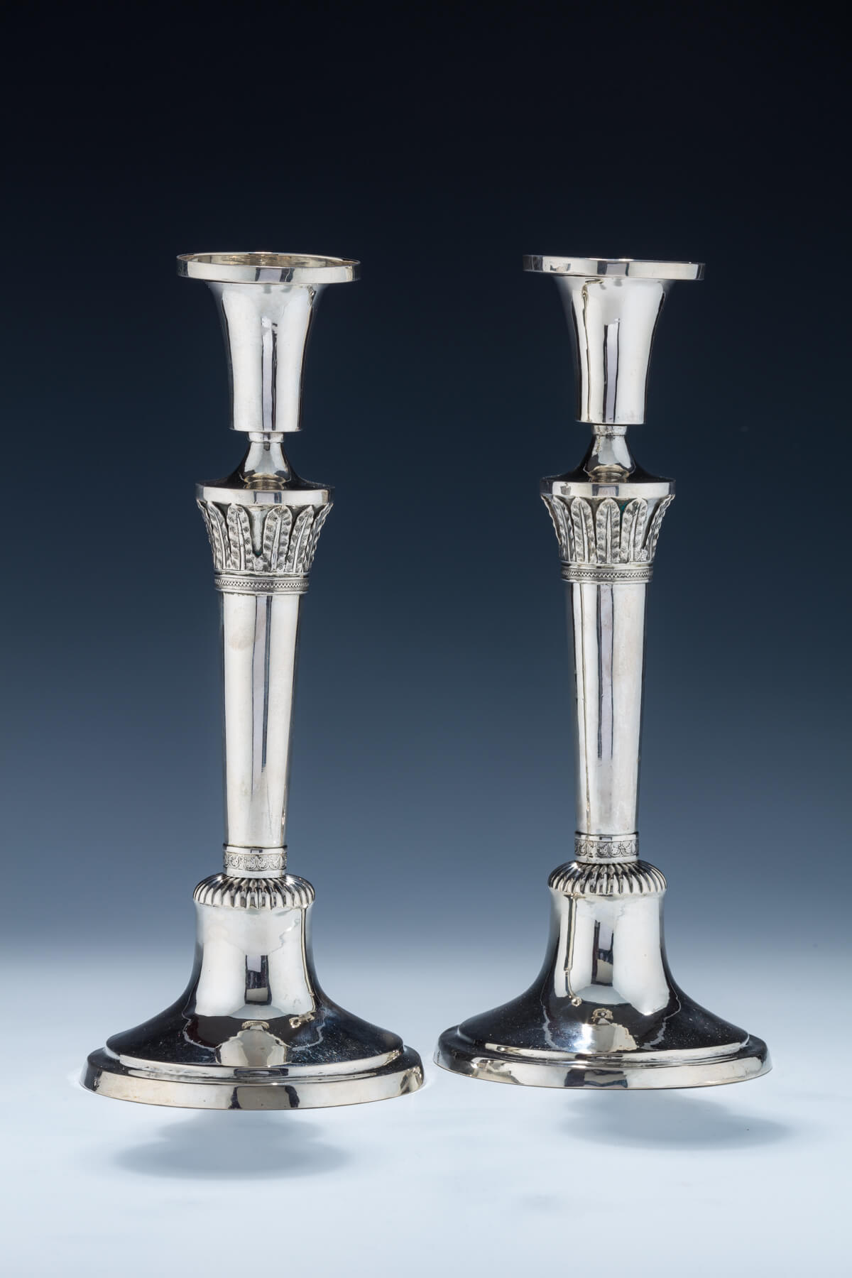 42. An Early Pair of Silver Candlesticks