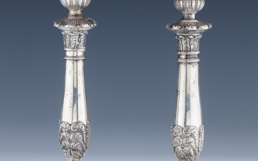 013. A Pair of Early Silver Candlesticks