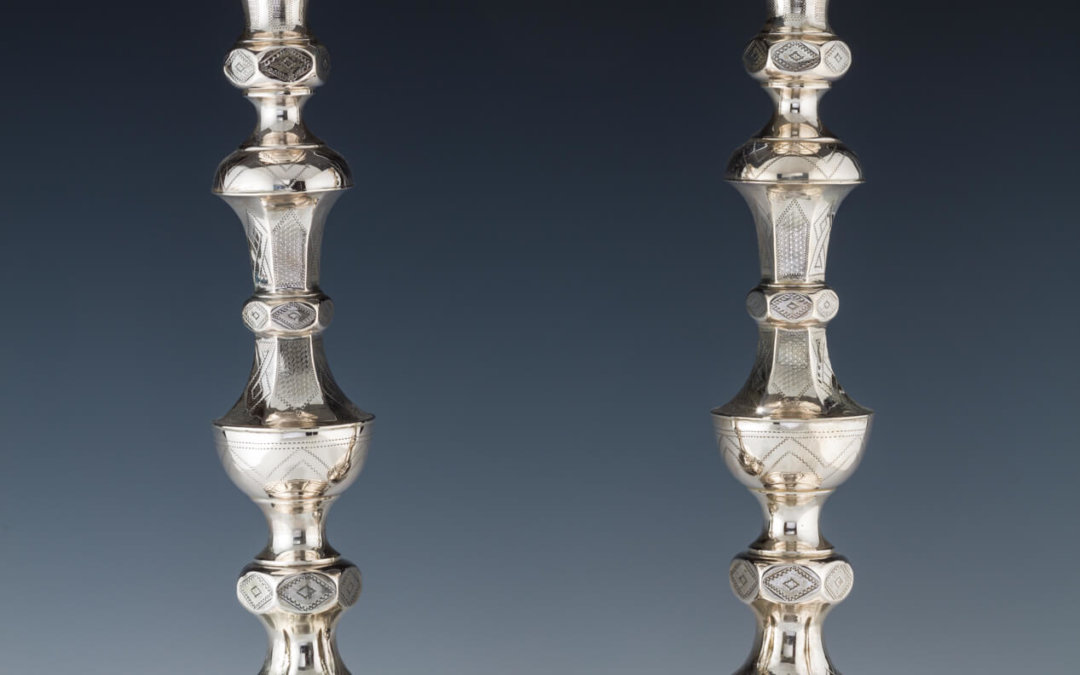 043. A PAIR OF LARGE SILVER CANDLESTICKS
