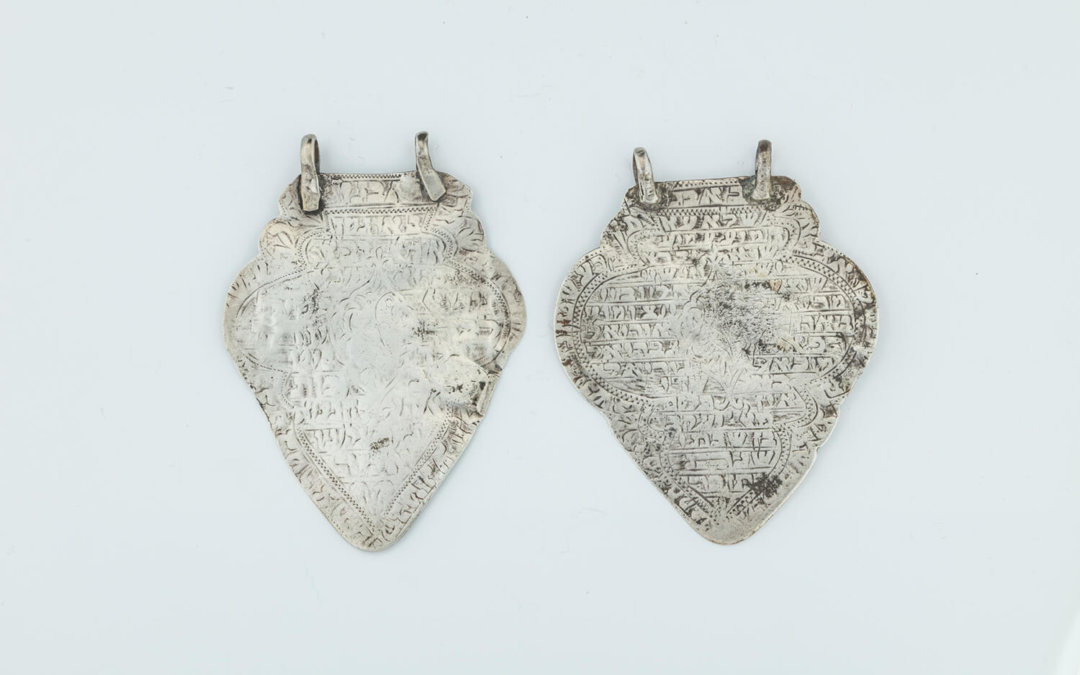 008. TWO EARLY SILVER AMULETS