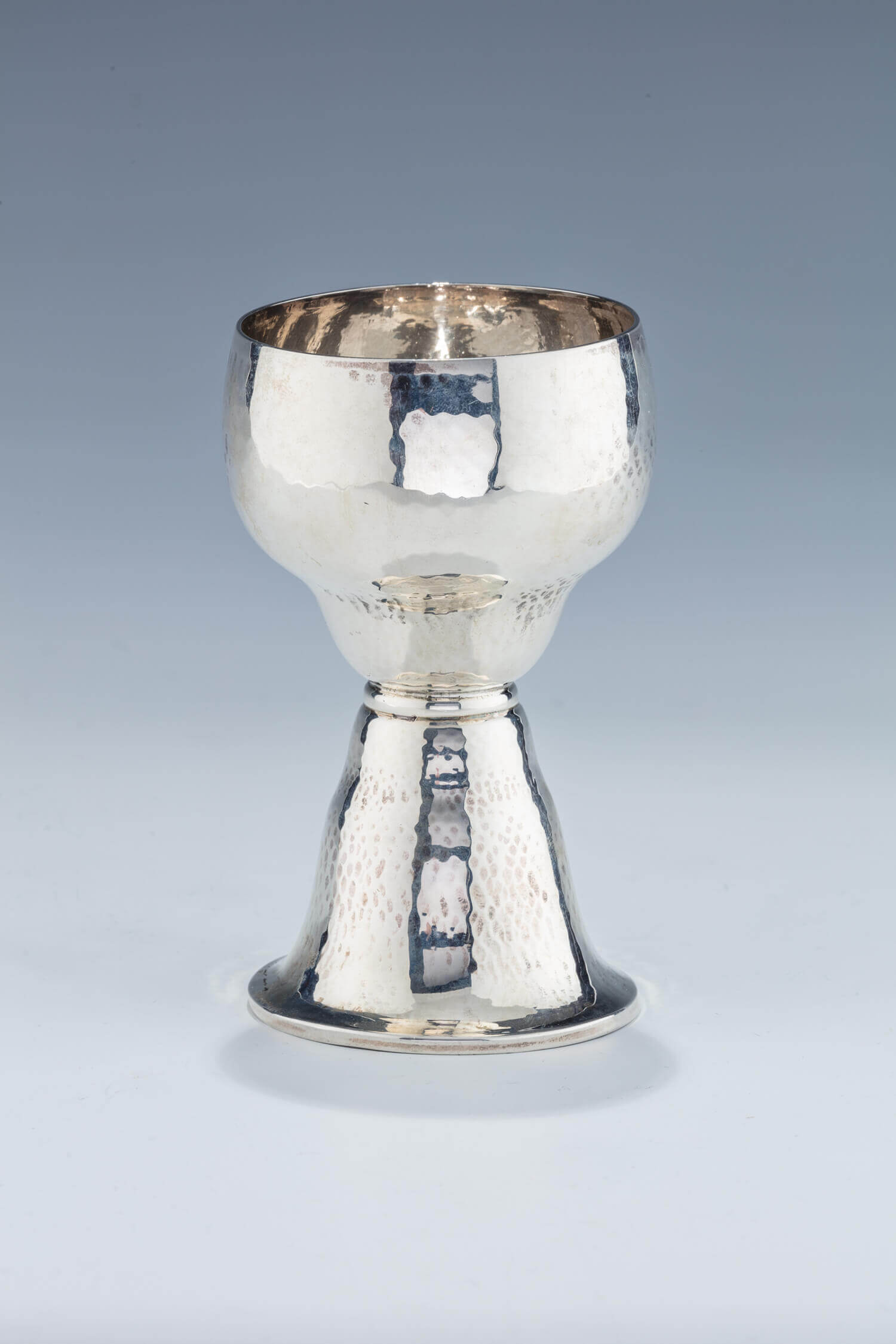 023. A LARGE HAND HAMMERED KIDDUSH CUP BY LAZARUS POSEN