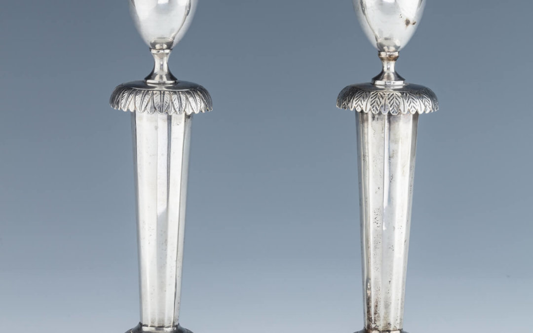 032. A PAIR OF SILVER CANDLESTICKS