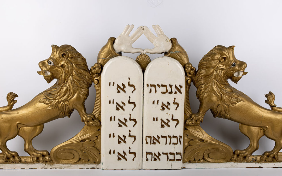 047. A LARGE PAIR OF WOODEN LIONS AND DECALOGUE