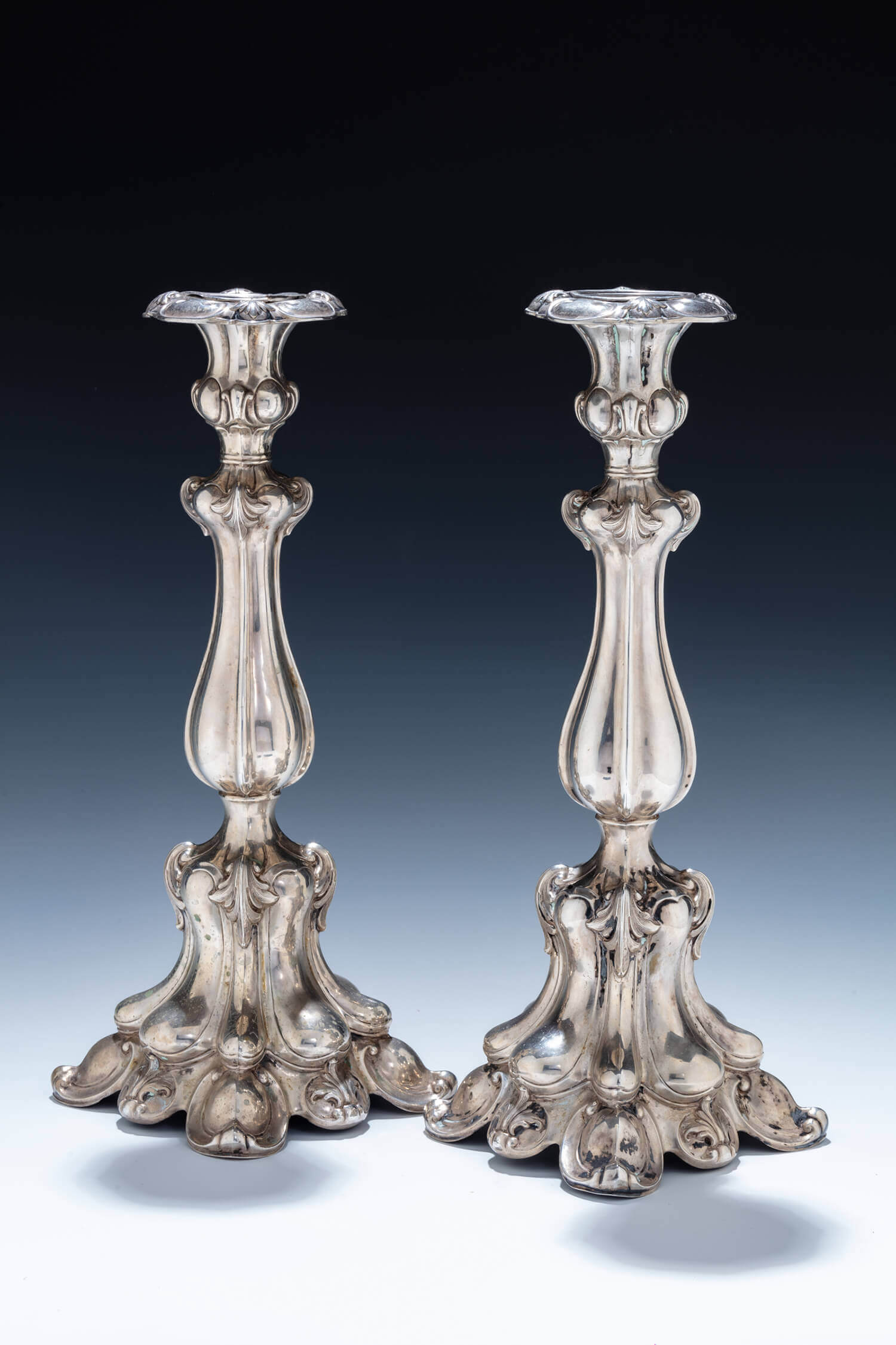 020. A PAIR OF SILVER CANDLESTICKS