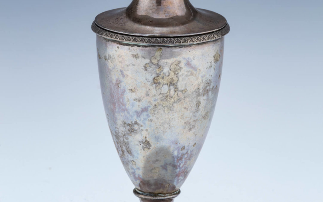 100. A SILVER URN SHAPED CONTAINER